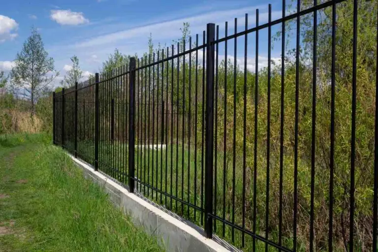 Black aluminum fence with concrete